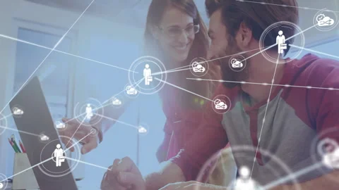 Project lead and developer reviewing laptop as person icon appearing and Stock Footage 310438148