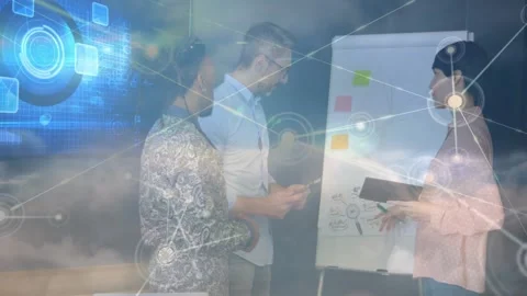 Project lead pointing at flipchart and tapping tablet starting cloud node Video stock 334036393