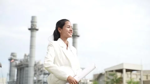 Project leader holding Hard Hat and drawing blueprint standing for looking on po 動画素材 279505285