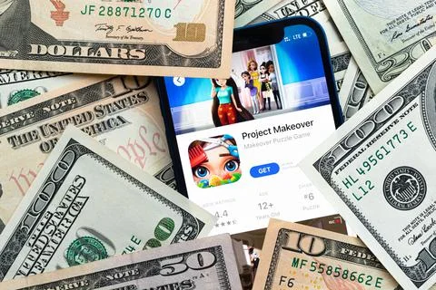 Project Makeover mobile game app. Money background. Concept, company making m Foto stock
