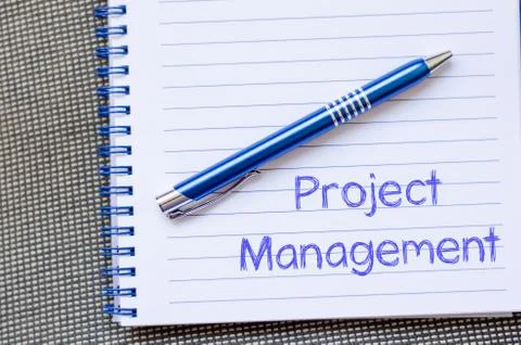 Project management write on notebook Stock Photos