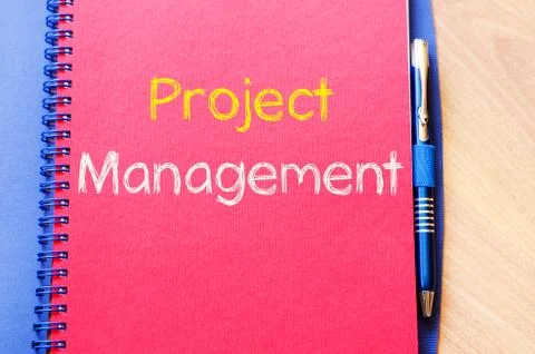 Project management write on notebook Stock Photos