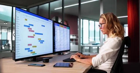 Project Manager Analyzing Gantt Chart For Task Scheduling Efficiency. Stock Photos
