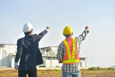 Project manager and Engineer construction holding hand success project,Produc Stock Photos
