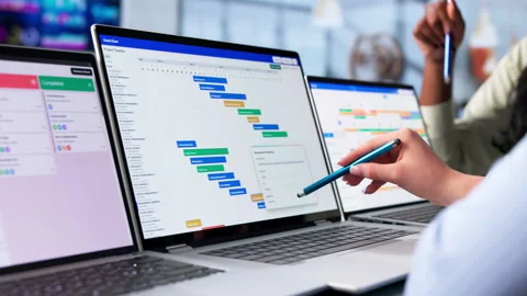 Project Manager And Team Discuss Agile Schedule Progress Stock-Footage 342980706