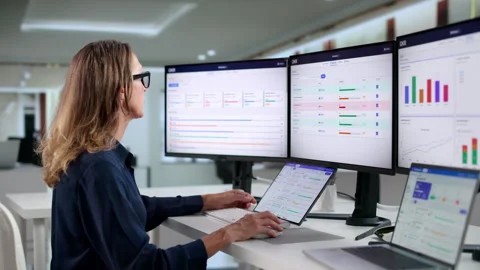 Project Manager Carefully Tracks Team’s OKR Performance Stock Footage 346325328