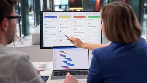 Project Manager Carefully Updates Event Schedule Using Scrum Software Stock Footage 332501289