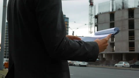 Project manager checking construction plan Stock Footage 65381211
