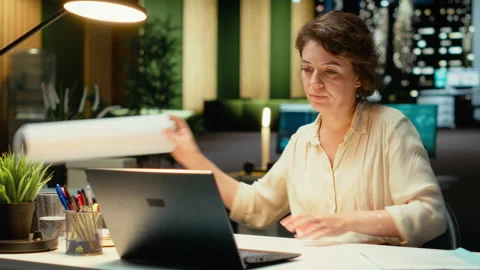 Project manager fixing targets and agenda after hours for evolution Stock Footage 317965300