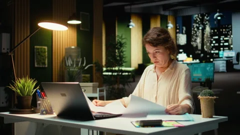 Project manager fixing targets and agenda after hours for evolution Stock Footage 317965397