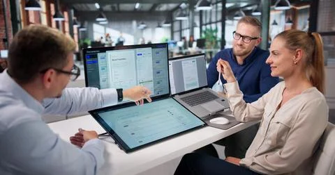 Project Manager Guides Diverse Team Using AI Software For Secure Document Man Foto stock