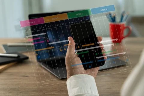 Project manager leading the computer interface update chart scheduling Proj.. Foto stock