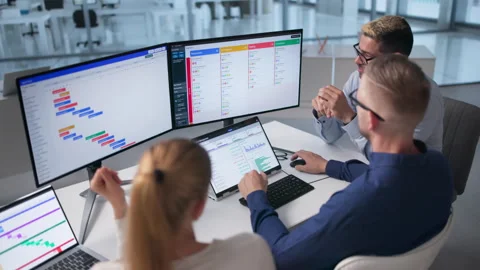 Project Manager Leads Diverse Team Using Laptop, Notebook, Stock Footage 336789614