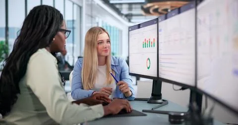 Project Manager Leads Diverse Team Using Dashboard To Track Goals Clearly. Stock Photos