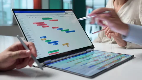 Project Manager Leads Team Reviewing Digital Gantt Chart Stock Footage 337629345