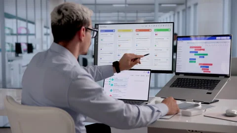 Project Manager Plans Daily Tasks Using Software Stock Footage 331517859