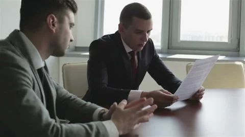 Project manager is reading the text and commenting on it emotionally. Stock Footage 63658013