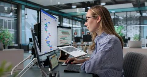 Project Manager Reviews Agile Task Board While Organizing Teams Busy Schedule Stock Photos