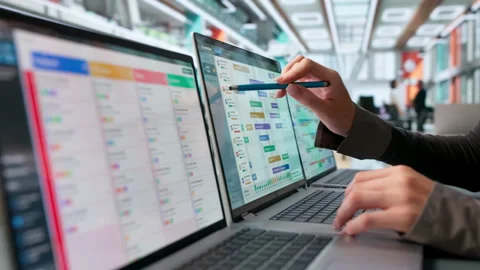 Project Manager Reviews Gantt Chart Schedule On Laptop Stock Footage 345327857
