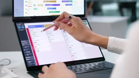 Project Manager Reviews Gantt Chart Schedule On Laptop Stock Footage 345330268