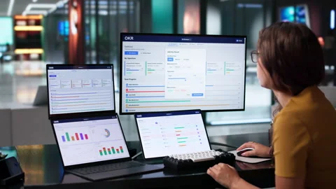 Project Manager Reviews OKR Dashboard Stock Footage 345333273