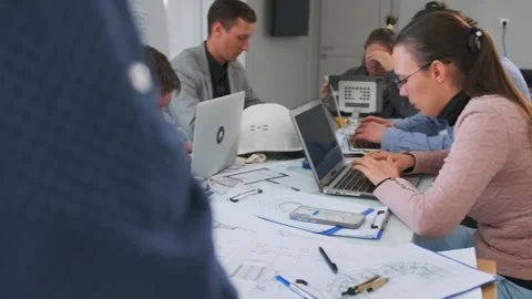 Project manager scolding architects during construction plan review Stock Footage 316045256