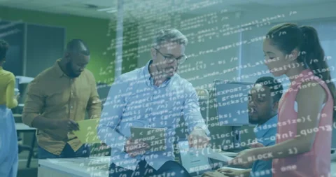 Project manager tapping tablet and pointing printout, team reviewing with Stock Footage 312229048