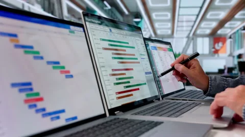 Project Manager Updates Agile Task Board While Using Laptop Video stock 336374019