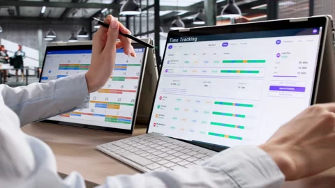 Project Manager Uses Digital Timesheet App On Hybrid Laptop Stock Footage 335880184