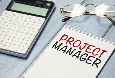 Project manager word on notebook with calculator and glasses Stock Photos