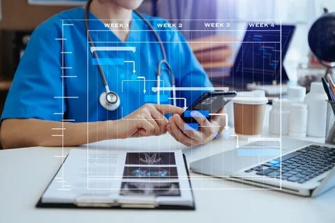 .Project manager working and update tasks with Gantt chart scheduling diagr.. Stock Photos