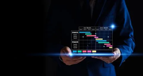 Project manager working on tablet and updating tasks and milestones progres.. Stock Photos