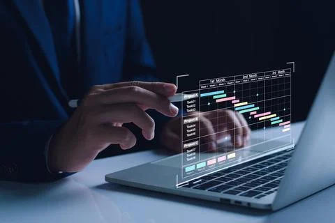 Project manager working on tablet. updating tasks and milestones progress pla Stock Photos