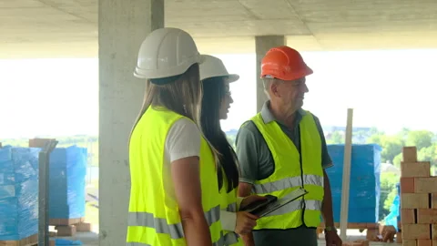 Project managers and builder inspect construction site Video stock 317611481