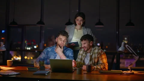 Project managers working late dark office. Team lead woman listening colleagues Stock Footage 339299553