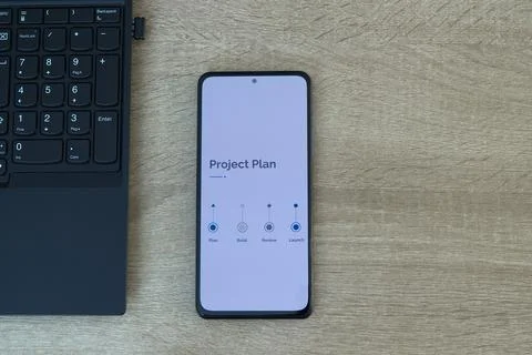 Project planning and management workflow on digital smartphone screen over .. Stock Photos