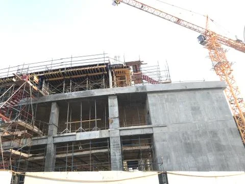 Project Site Construction under progress using tower crane and activities lik Stock Photos