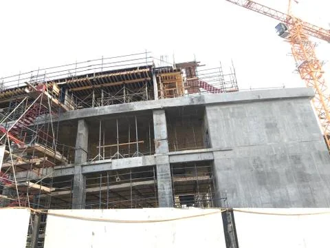 Project Site Construction under progress using tower crane and activities lik Stock Photos