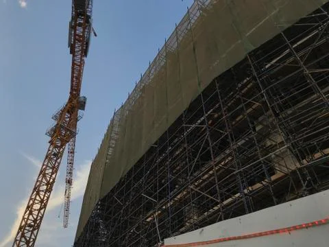 Project Site Construction under progress using tower crane and activities lik Stock Photos