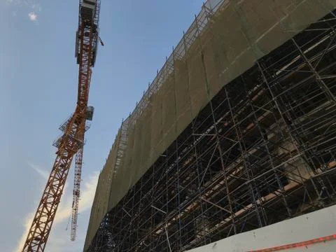 Project Site Construction under progress using tower crane and activities lik Stock Photos