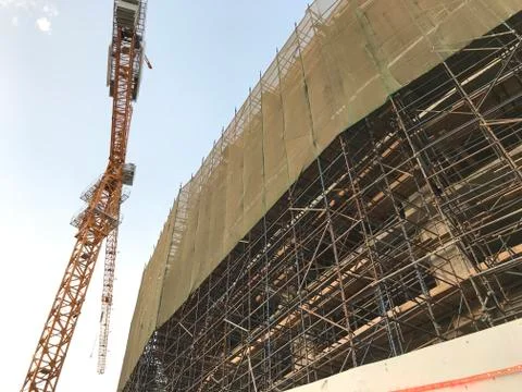 Project Site Construction under progress using tower crane and activities lik Stock Photos