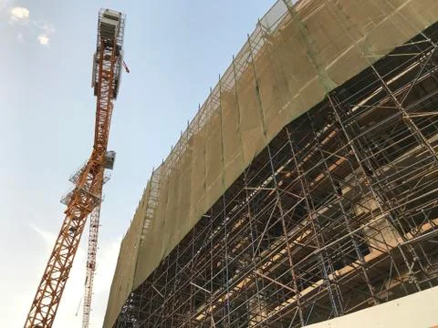 Project Site Construction under progress using tower crane and activities lik Stock Photos