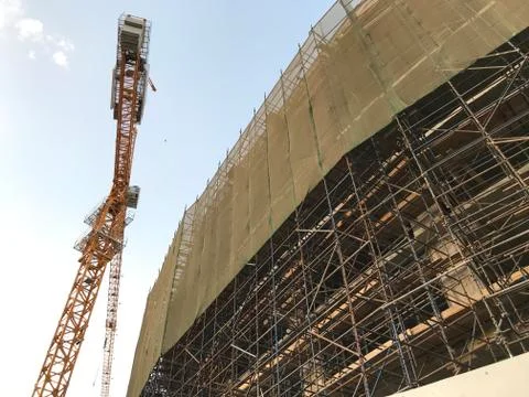 Project Site Construction under progress using tower crane and activities lik Stock Photos