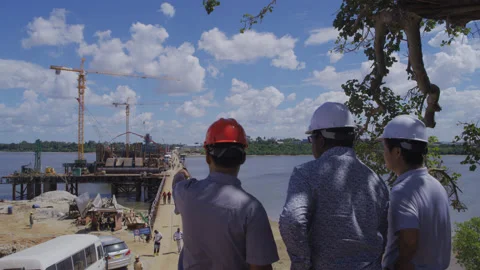 Project supervision inspects bridge construction site,Tanzania  Africa Stock Footage 132542246