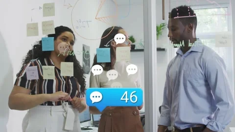 Project team organizing ideas as comment count rises, moving notes and sketching Stock Footage 318260395