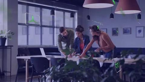 Project team pointing at layout on meeting table, causing green AR icons, Stock Footage 335316634