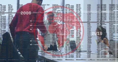 Project team reviewing data leaning over table after peer placing laptop red Stock Footage 321452902