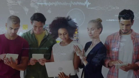 Project team tapping devices in tech studio, creating HUD wave and scrolling Stock Footage 329928805