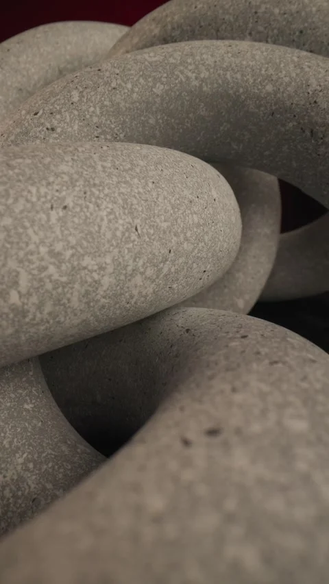 Project video of intertwined stone rings connecting each other illustrating the Video stock 283983148