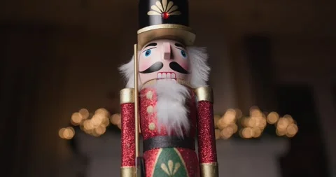 Project video of wooden festive Nutcracker figurine spinning with glowing bokeh Stock Footage 287176865